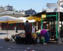 Setting up to sell produce in the district square